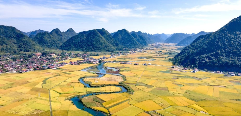 Arial view of a mountain valley with a river winding through